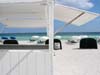 * Thumbnail image: The peaceful serenity of a clean white beach shot through an empty towell stand