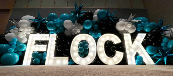 Letters and balloons at a FLOCK event