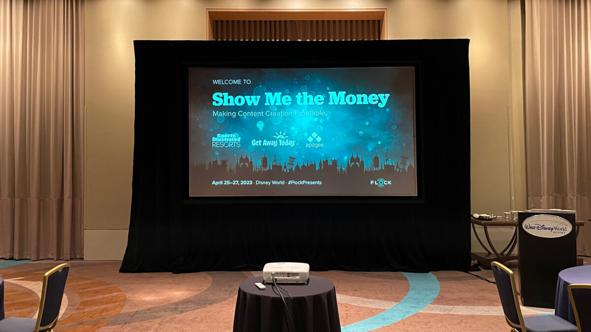 Screen showing the projected title slide for Show Me the Money event at Disney World.